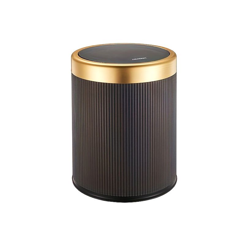 Black Elegance Oval Waste Solution trash can with a press-top lid and gold rim, shown on a clean white background.