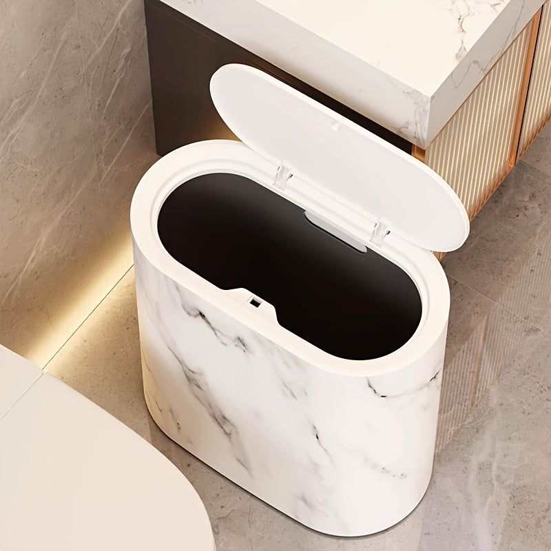 An open Cream White Luxe Marble Canister, viewed from above, showcasing its secure lid and interior. This modern trash can is an elegant solution for home organization in a contemporary bathroom.